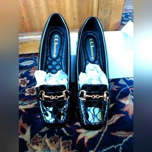 Brand new black shoes with gold color buckle